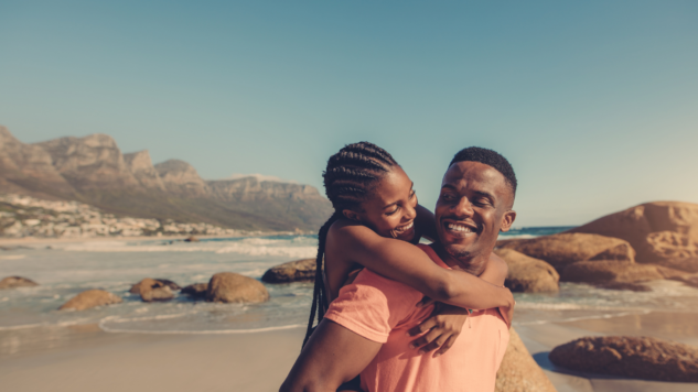 Boyfriend and girlfriend having fun on the beach