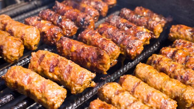 Minced meat rolls being grilled