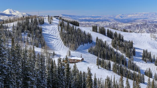 Alpine downhill ski runs on a blue sky day in winter in Aspen, Colorado