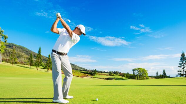 person playing golf on golf course