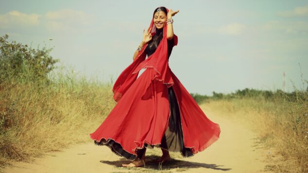 woamn dancing in red dress