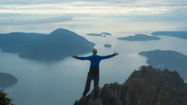 person overlooking mountains