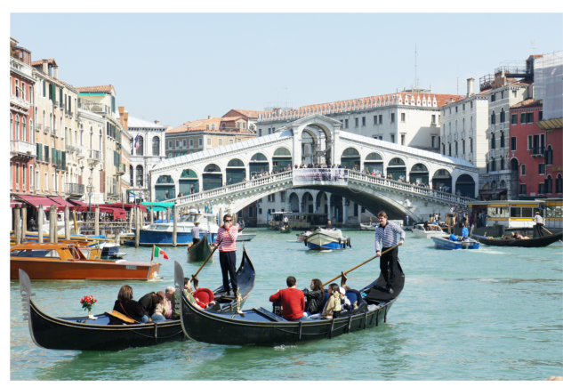 A scence on the Grand Canal in Venice with gondolas