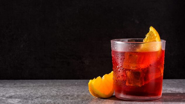 Negroni drink in front of black background