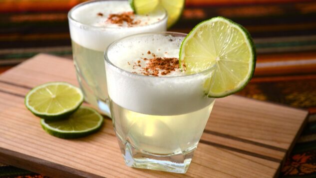 Two pisco sours on wooden table